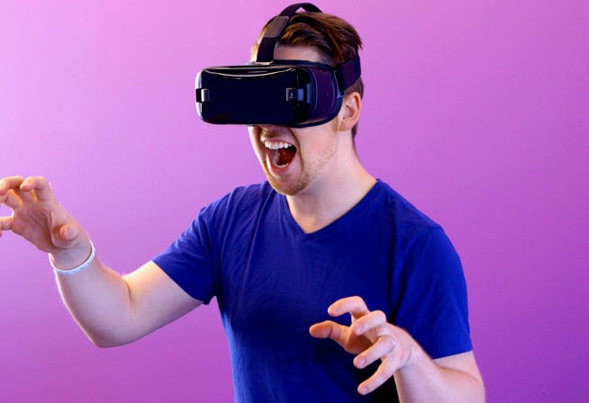 A person playing with VR glasses